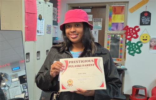  parent Ms. Glenn holding certificate.